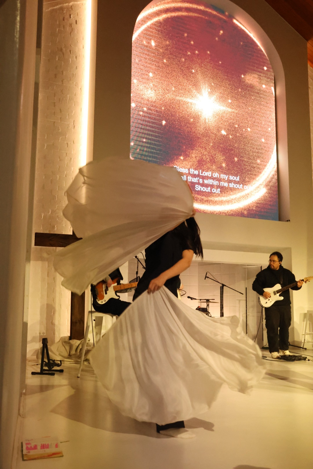 Worship with white flags at Saints Church